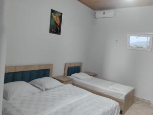 Postel nebo postele na pokoji v ubytování Guesthouse Achi