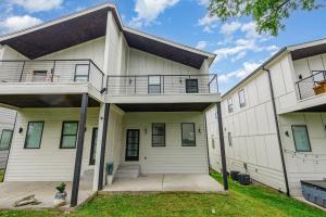 an exterior view of a white house with a porch at Double Time - Ping-Pong Table - Mins to Germantown in Nashville