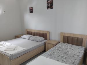 Postel nebo postele na pokoji v ubytování Guesthouse Achi
