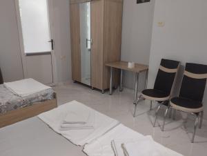 Postel nebo postele na pokoji v ubytování Guesthouse Achi