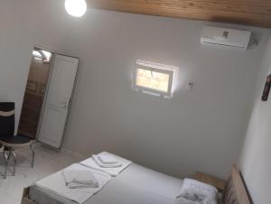 Postel nebo postele na pokoji v ubytování Guesthouse Achi + 37 fotografií