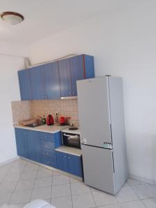 Kuchyň nebo kuchyňský kout v ubytování KARAOYLI apartments studios + 16 fotografií
