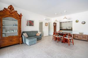 a living room with a couch and a table at GuestHost - Oasi Monticelli in Polignano a Mare