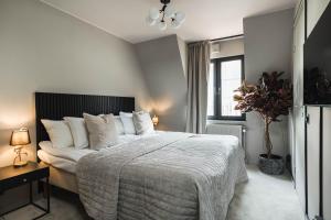 Postel nebo postele na pokoji v ubytování Villa Gutebagge Hotell