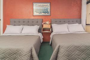Postel nebo postele na pokoji v ubytování Innovar Casa Hostal