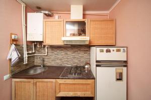 a small kitchen with a sink and a refrigerator at Holiday Home Ruben in Odzun