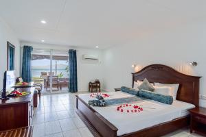 Postel nebo postele na pokoji v ubytování La Digue Island Lodge