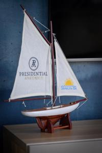 a small sail boat sitting on a table at Słoneczna 10a w Jarosławcu Apartamenty nad morzem in Jarosławiec