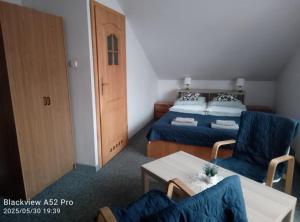 Postel nebo postele na pokoji v ubytování Dom Kącik