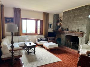 a living room with a couch and a fireplace at Villa Nia affittacamere in Palestrina