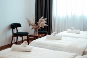 Letto o letti in una camera di Hotel Blini