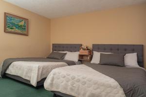 Postel nebo postele na pokoji v ubytování Innovar Casa Hostal