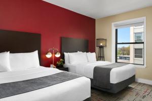 Postel nebo postele na pokoji v ubytování Majestic Hotel