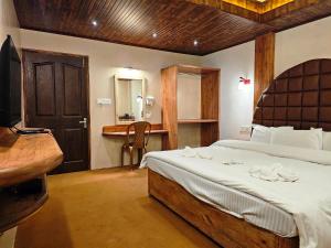 Postel nebo postele na pokoji v ubytování Hotel Golden Orchid