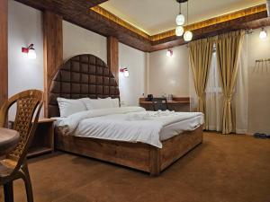Postel nebo postele na pokoji v ubytování Hotel Golden Orchid