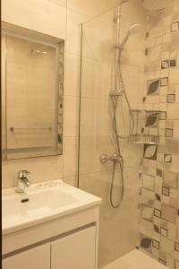 a bathroom with a shower and a sink at Sunset and Seaview Apartment No 4 in Mellieħa