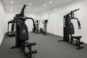 a gym with several tread machines in a room at YOEL Hotel Restaurante y Centro de Negocios in Atlacomulco de Fabela