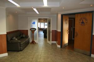 a hallway with a couch and a door in a building at Hotel North in North Sydney