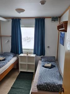 Postel nebo postele na pokoji v ubytování Gamvik brakkebo as + 37 fotografií