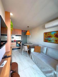 a living room with a couch and a table at Beira-mar c/ Vista Mar | TKTU | Apt. 103 in Porto De Galinhas