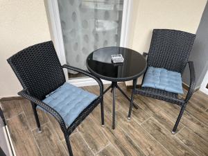 two chairs and a table in a room at Sunny Beach in Veliko Gradište +6 photos