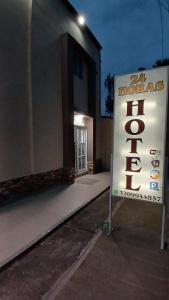 a sign in front of a building with a hotel sign at Hotel Central La Jagua in La Jagua de Ibirico