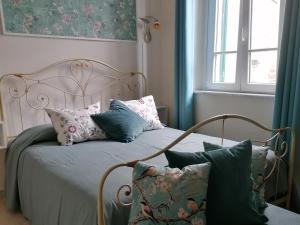 Ένα ή περισσότερα κρεβάτια σε δωμάτιο στο B&B Villa Lula Lucca