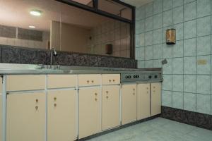 Kuchyň nebo kuchyňský kout v ubytování Innovar Casa Hostal