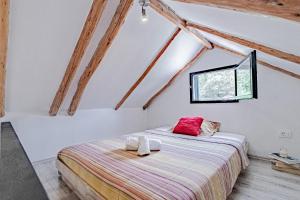 a bedroom with a bed with towels on it at House Komadic raja in Blato +29 photos