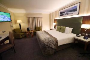 Telewizja i/lub zestaw kina domowego w obiekcie Vaughan Lodge Hotel