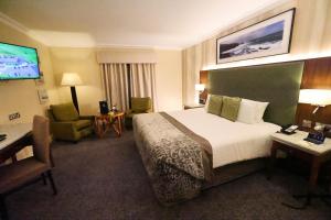 Telewizja i/lub zestaw kina domowego w obiekcie Vaughan Lodge Hotel