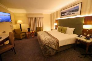 Telewizja i/lub zestaw kina domowego w obiekcie Vaughan Lodge Hotel