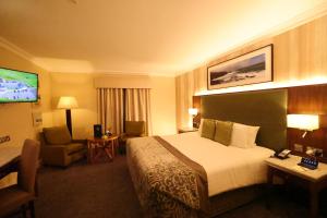 Telewizja i/lub zestaw kina domowego w obiekcie Vaughan Lodge Hotel