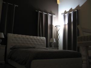Postel nebo postele na pokoji v ubytování B&B Borgo Arcadia