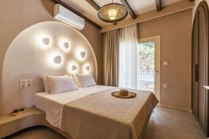 Ένα ή περισσότερα κρεβάτια σε δωμάτιο στο Villa Nanoula