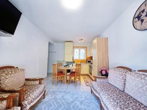 a living room with a couch and a table at Casa Orange in Cadenazzo
