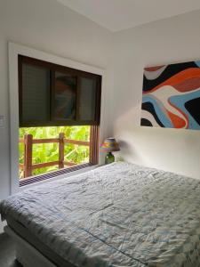 Giường trong phòng chung tại Espetacular casa para família!