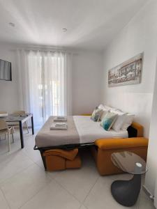 a bedroom with a bed and a dining room at Cherry rooms in La Spezia