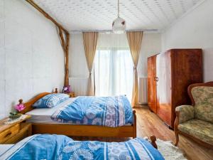 Postel nebo postele na pokoji v ubytování Etno smeštaj Stojadinović