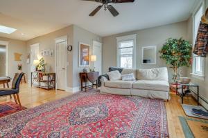 a living room with a couch and a rug at Less Than 1 Mi to Xcel Energy Center Walkable Hideaway! in Saint Paul