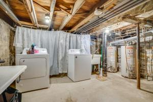 a laundry room with two machines and a sink at Less Than 1 Mi to Xcel Energy Center Walkable Hideaway! in Saint Paul