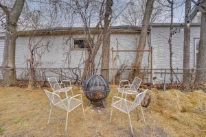 a group of chairs and a grill in front of a house at Less Than 1 Mi to Xcel Energy Center Walkable Hideaway! in Saint Paul