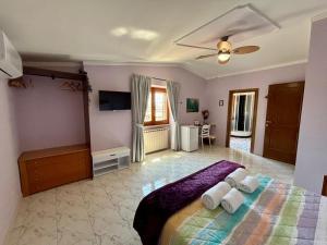 a bedroom with a bed with two pillows on it at B&B Buena Vista in Fiumicino