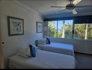 Ένα ή περισσότερα κρεβάτια σε δωμάτιο στο On the Beach, uMhlanga rocks