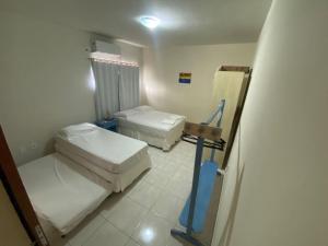 a hospital room with two beds in it at Apartamento Baixu 2 in Prado +6 photos