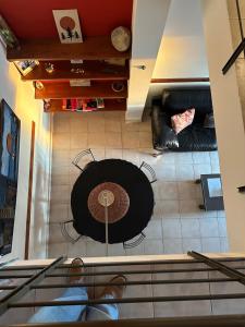 an overhead view of a living room with a table and chairs at Departamento con Balcón y Asador in Río Cuarto +9 photos