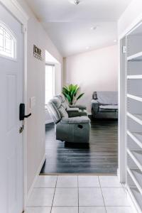 a living room with a couch and a chair at 4-bedroom Burlington with AC & Wifi in Burlington