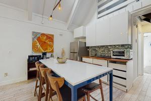 a kitchen with a blue table and chairs at The Wild Pine Lodge in Incline Village