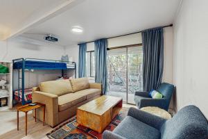 a living room with a couch and a bunk bed at The Wild Pine Lodge in Incline Village