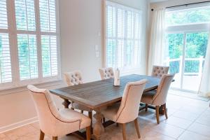 a dining room with a wooden table and chairs at Grande at Canal Pointe --- 37546 Worcester Dr. in Rehoboth Beach